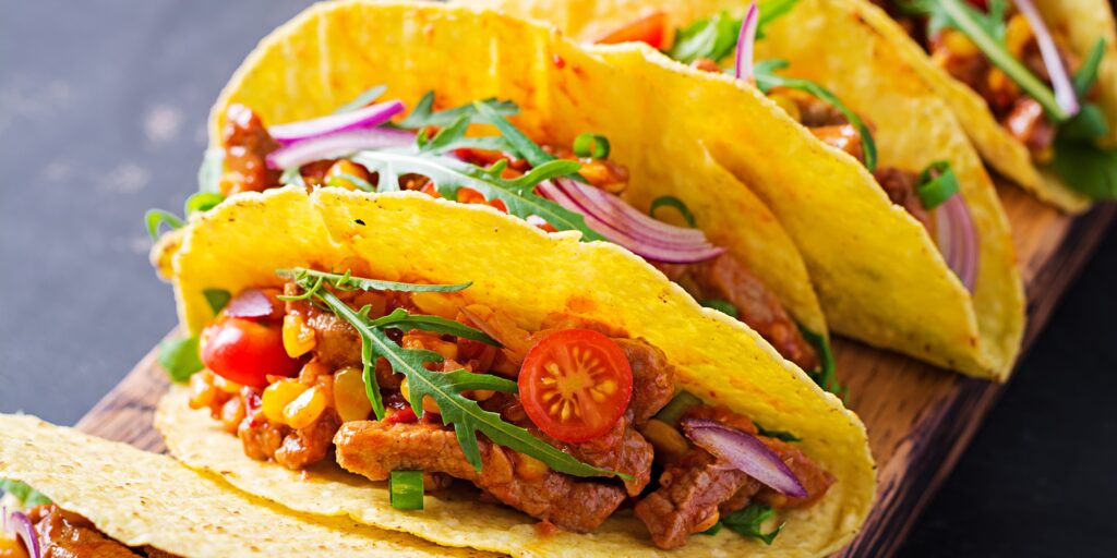 Taco. Mexican tacos with beef meat, corn and salsa. Mexican cuisine. copy space.