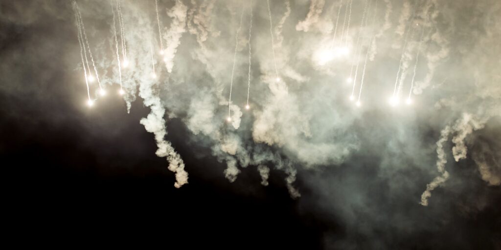 Launching missiles in the night. War concept image with dramatic sky.