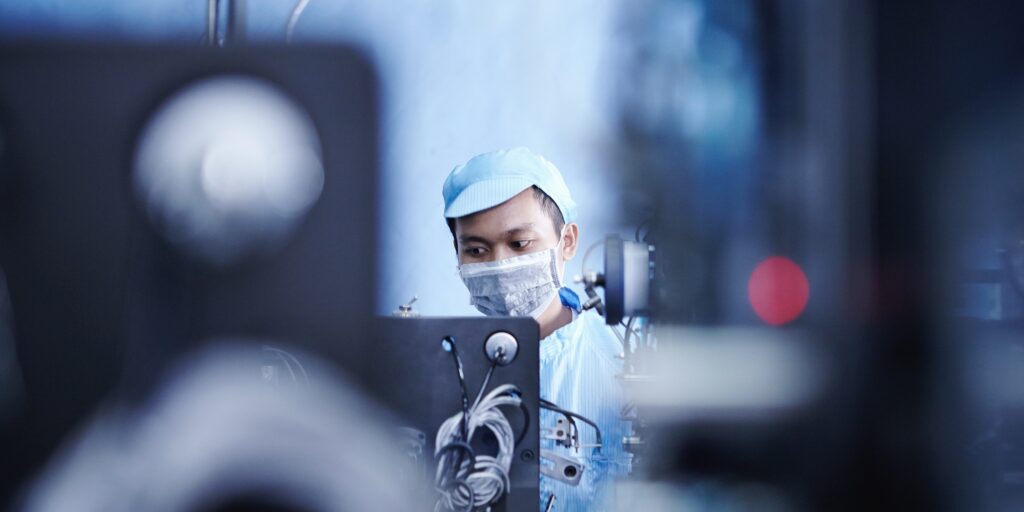 Worker at e-cigarettes battery factory, Guangdong, China