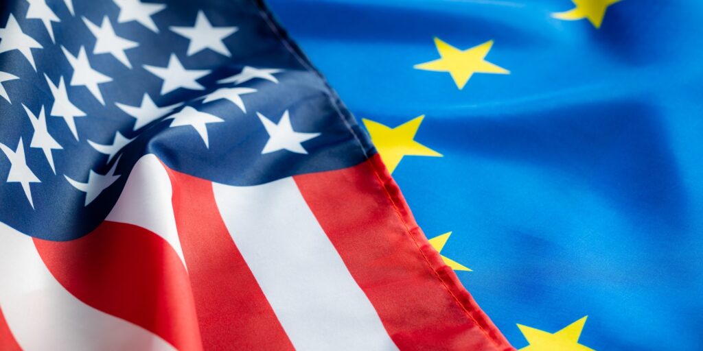 Eu europe union flag and usa united states of america flag. Two waving flags