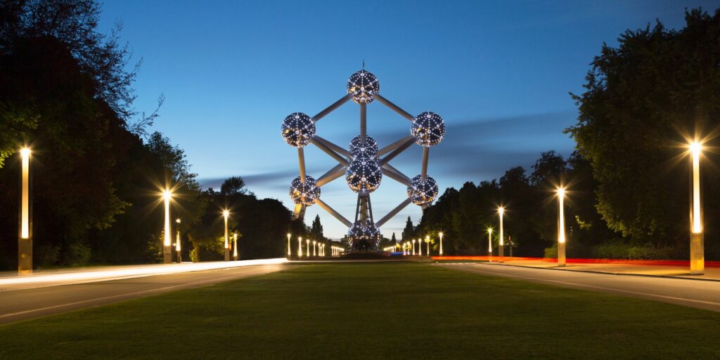 Evening lights trail past the iconic Atomium in Brussels