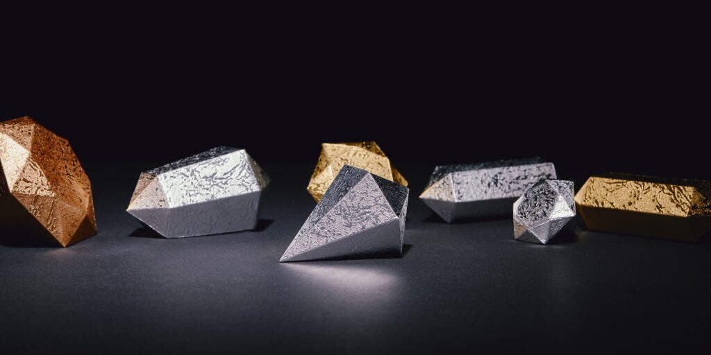 shiny pieces of silver and gold on black background