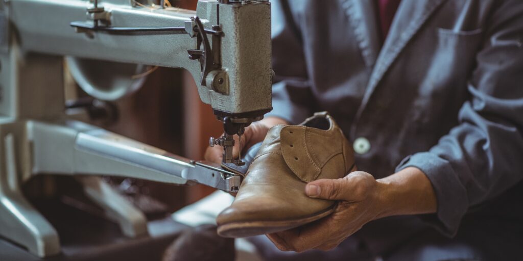 Shoemaker using sewing machine