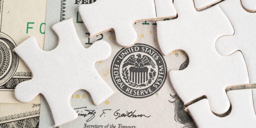 FED The Federal Reserve System with jigsaw puzzle paper, the central banking system.