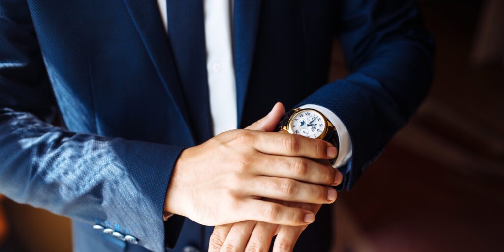 Stylish men's wrist watch, man is watching the time. . Businessman checking time on his wristwatch.